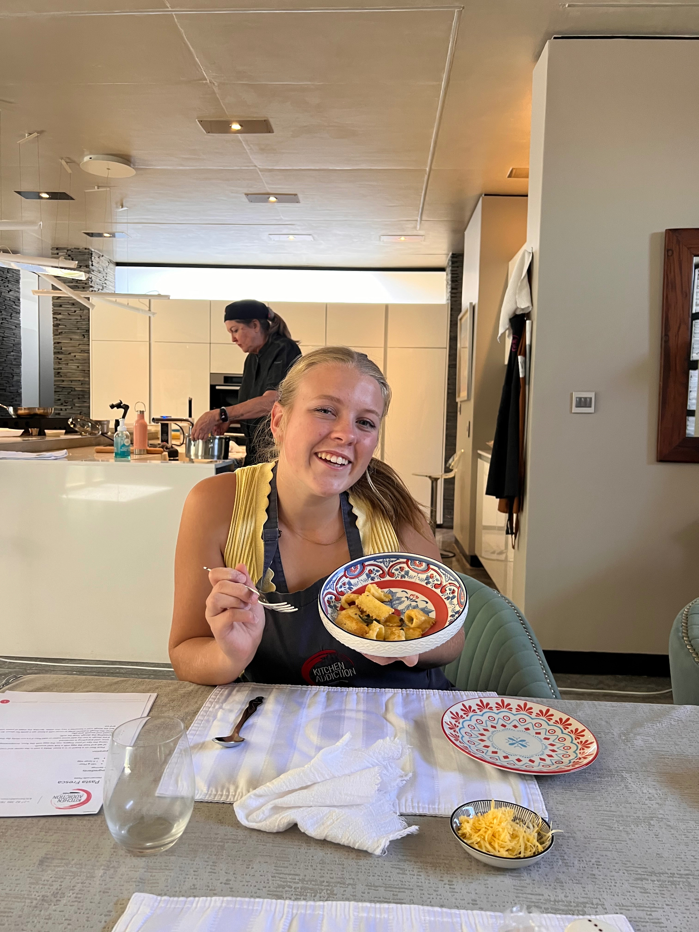 Guests cooking at a Kitchen Addiction class