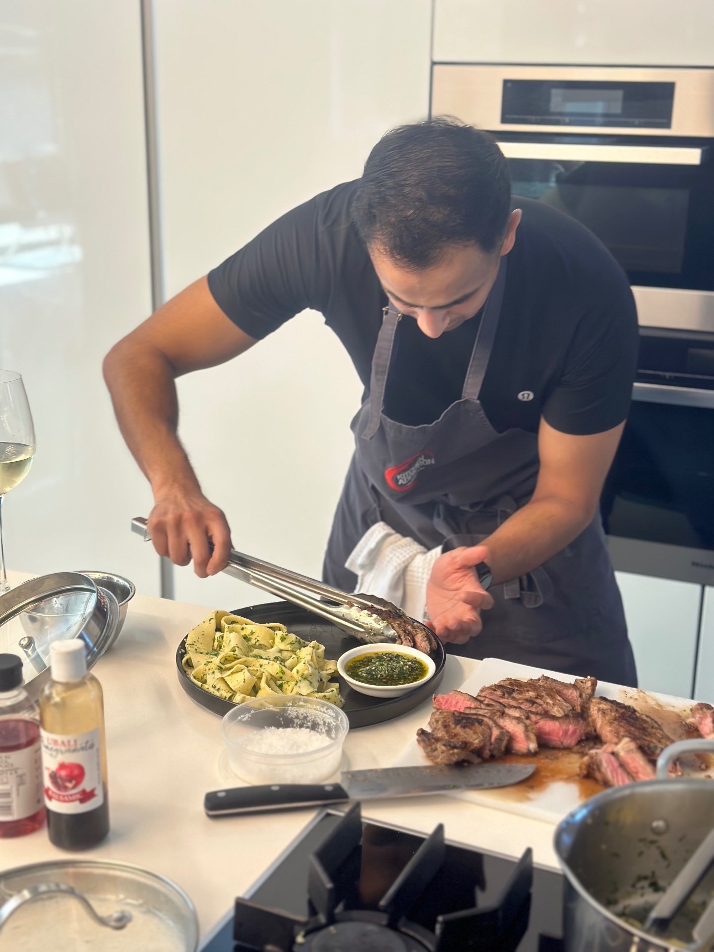 Guests cooking at a Kitchen Addiction class