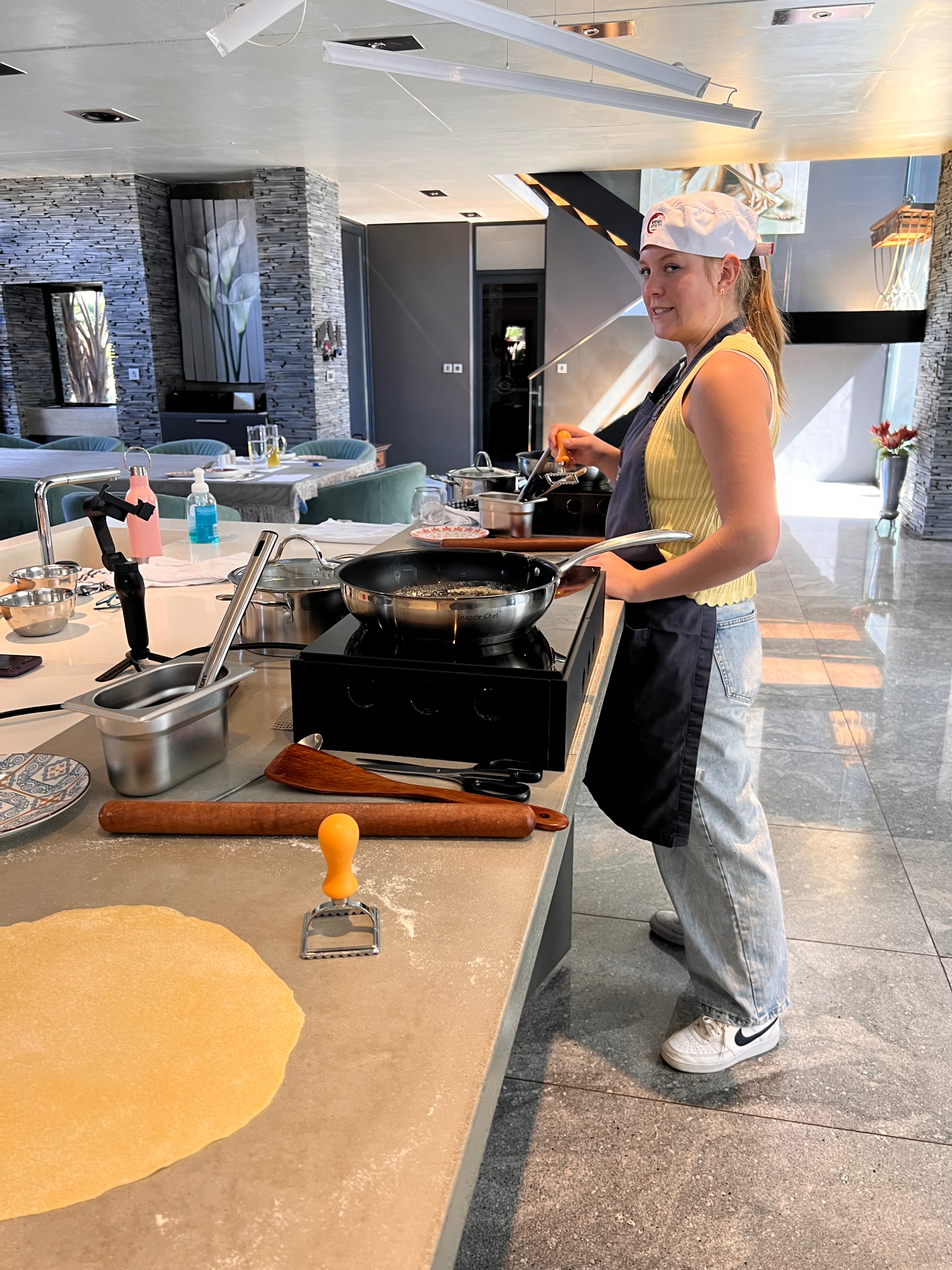Guests cooking at a Kitchen Addiction class